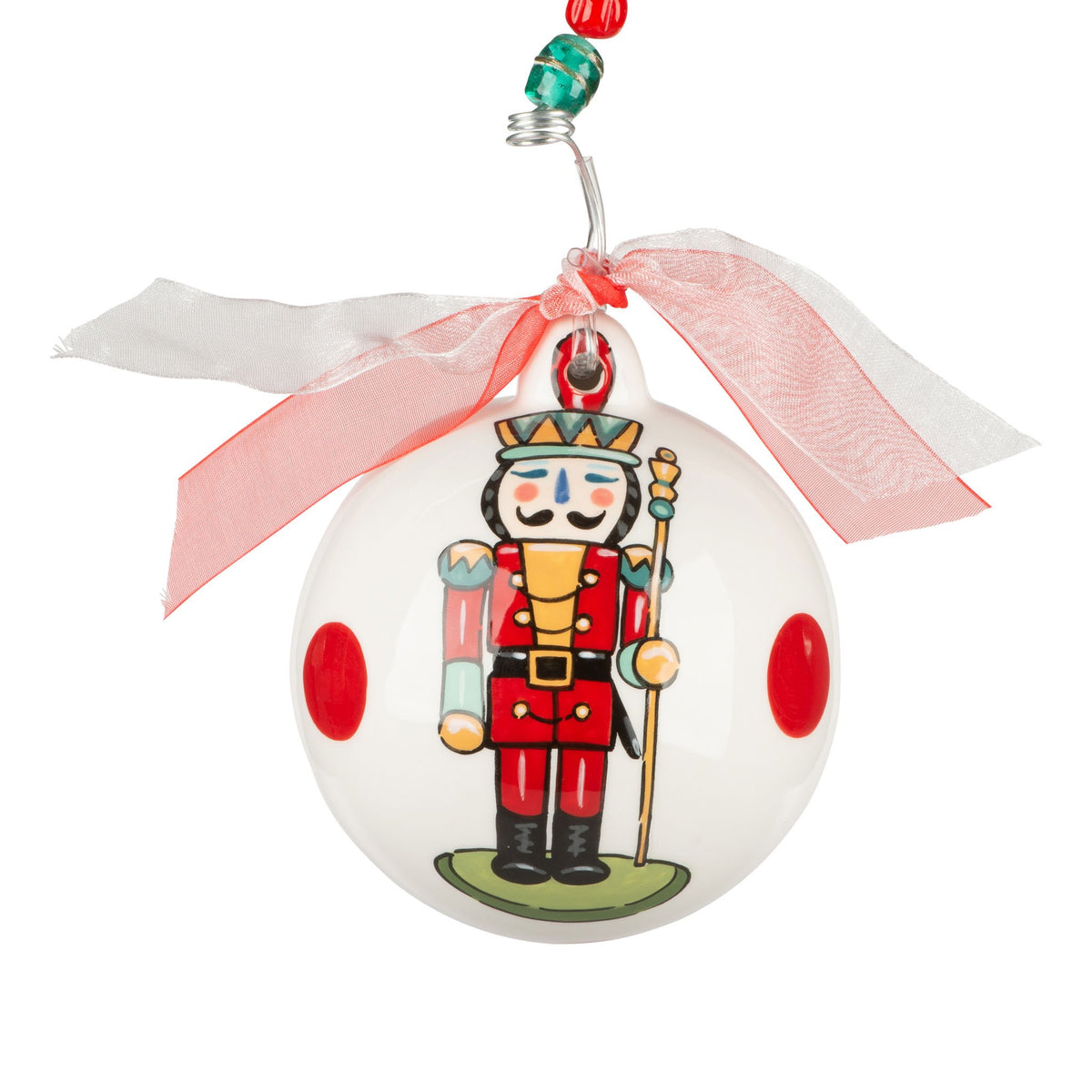 Hand-painted red ceramic nutcracker ornament with a classic soldier silhouette.