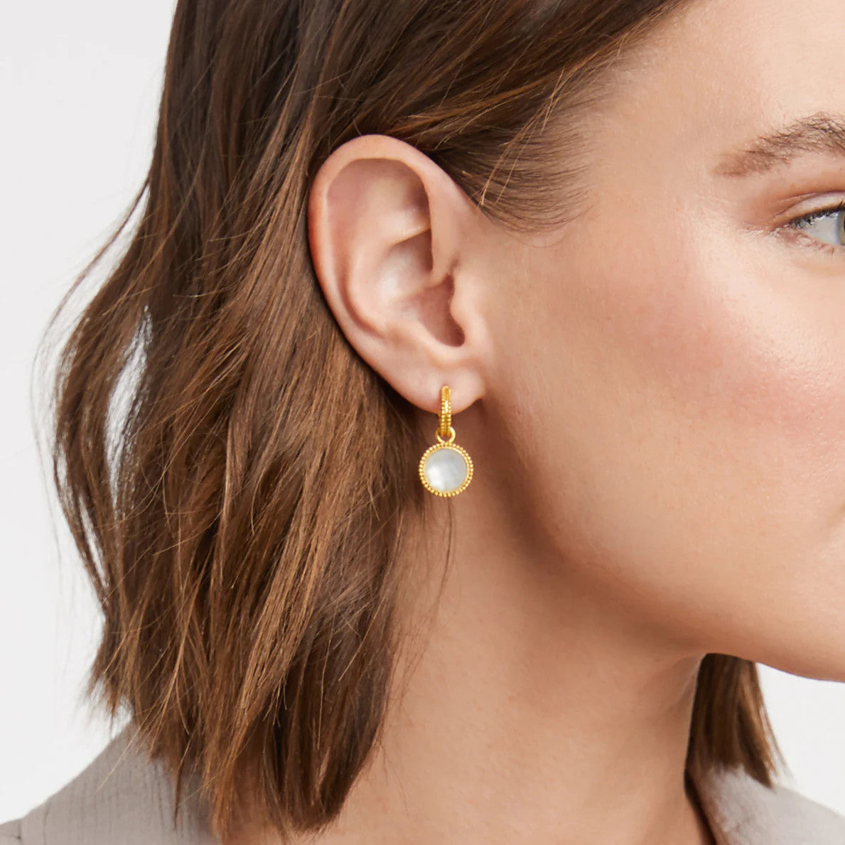 Fleur-de-Lis hoop earring with mother-of-pearl charm in gold-tone finish