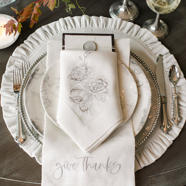 Round ruffle velvet placemat in a soft neutral tone with an 18-inch diameter.