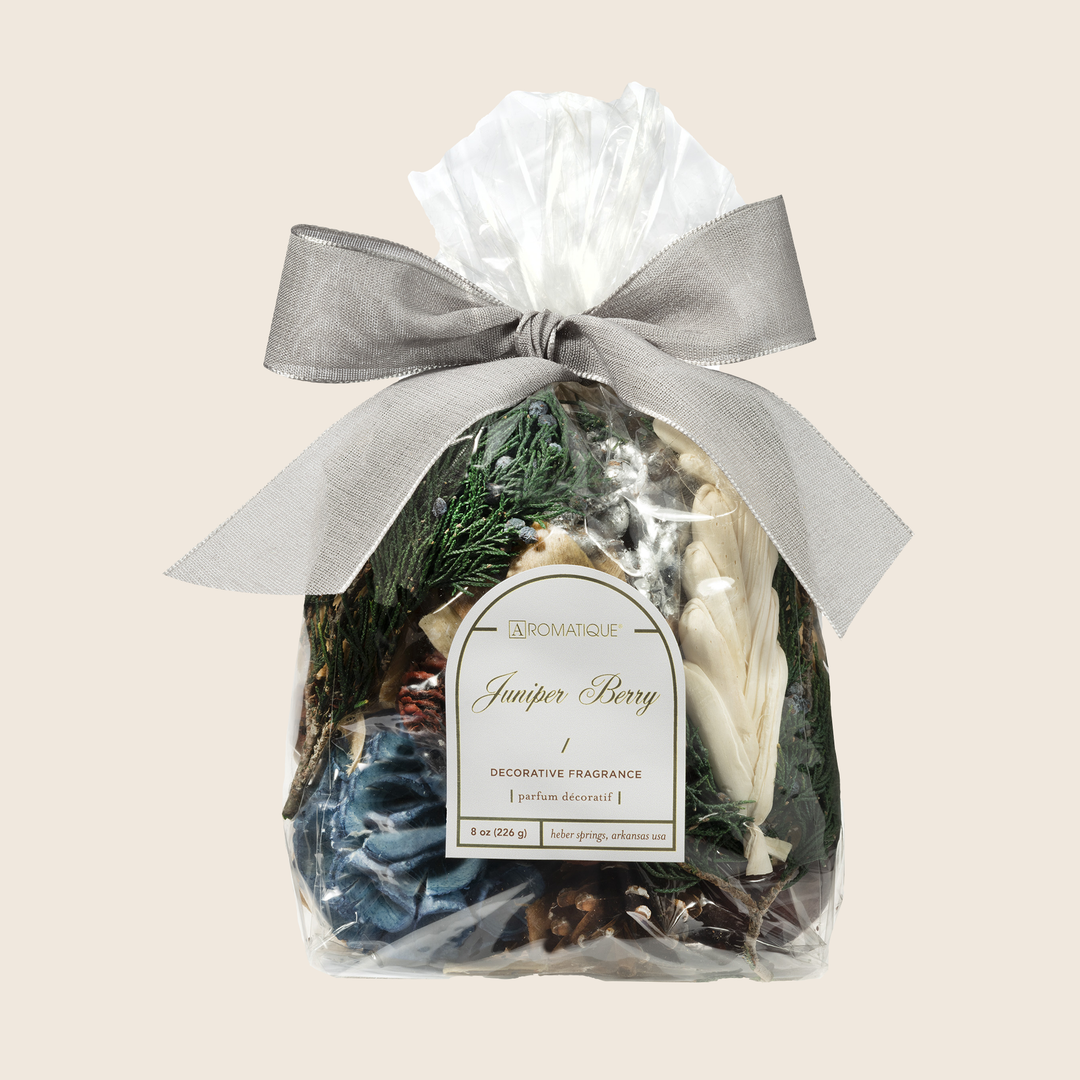 Aromatique Juniper Berry decorative fragrance potpourri in a clear bag with a silver ribbon bow.