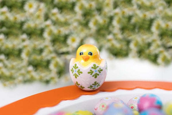 Mini plush chick in an egg shell with pastel yellow body and white speckled pattern