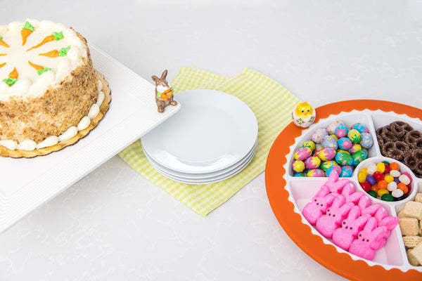 Mini One Cool Chick plush toy in egg shape with yellow chick face on white fabric.