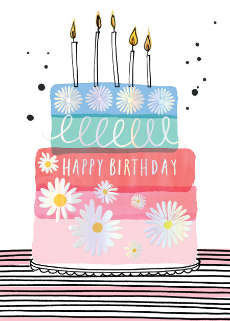 Artistic multi-layered birthday cake with daisies, holographic foil, and five lit candles.