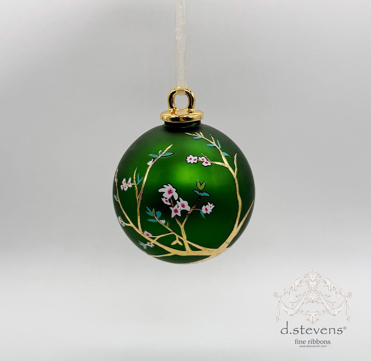 100mm emerald green glass ball ornament featuring gold cherry blossom branches and pink flowers.