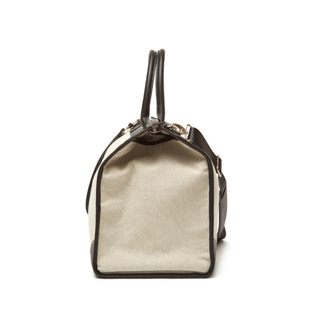 Black Capri boarding bag with structured rectangular shape.