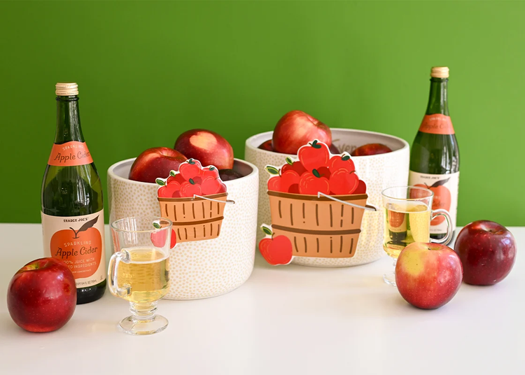 Basket of Apples Big Attachment on a white bowl with apples and sparkling cider.