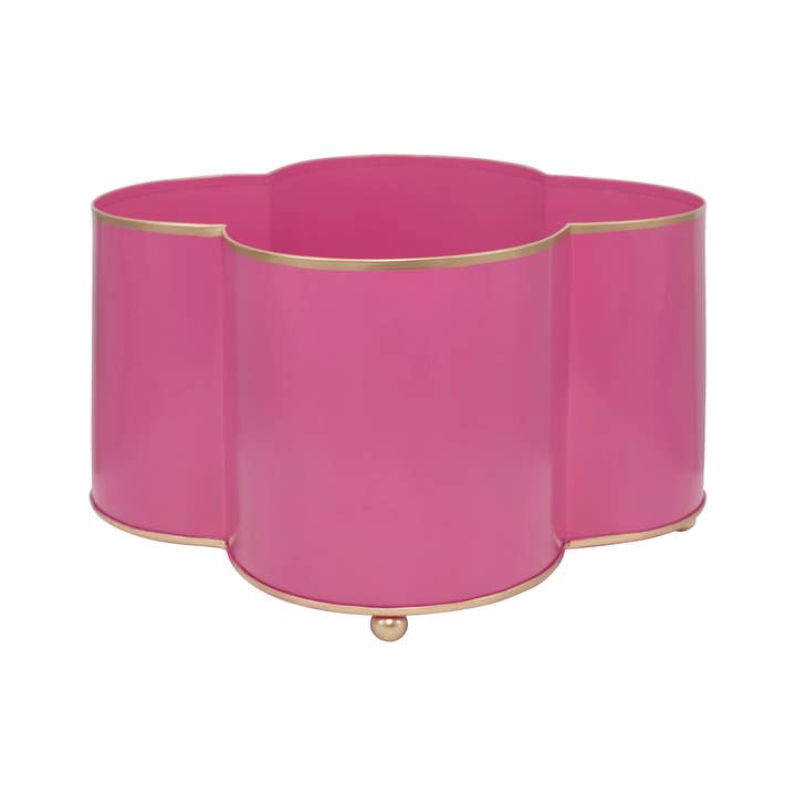 Mattie Quatrefoil Cachepot Planter in pink with gold trim and ball feet.