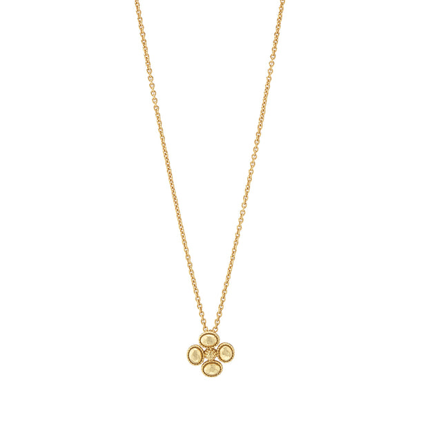 Gold Berry Clover Station Necklace with a four-petal clover pendant on a dainty chain.