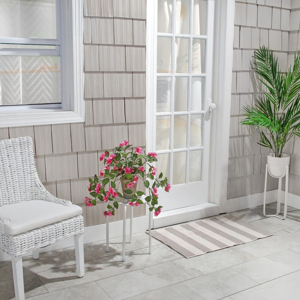 Hanging artificial impatiens plant with realistic blooms in a UV-resistant planter.