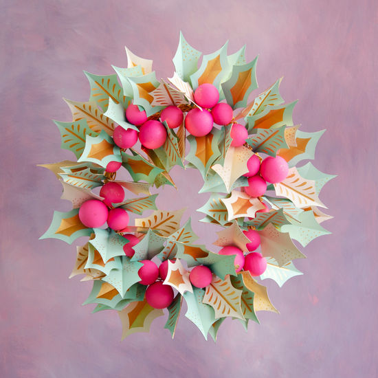 30-inch papermache holly wreath with mint green and gold leaves and bright pink berries.