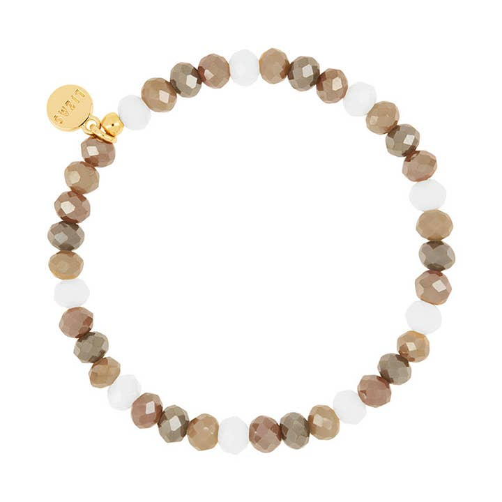 Nashville Creation Bracelet with faceted brown and white glass beads and a gold logo charm.