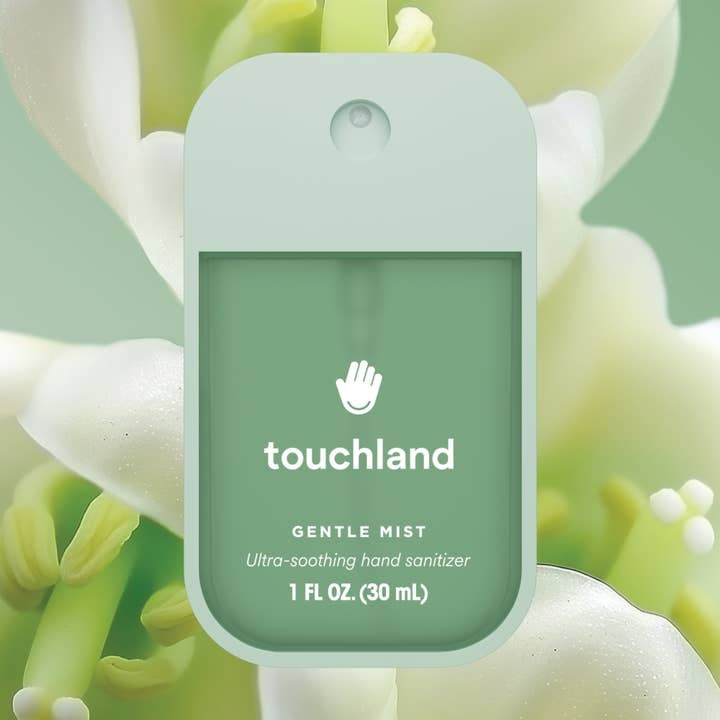 Lily of the Valley Gentle Mist hand sanitizer in a clear bottle with white liquid and green floral label.