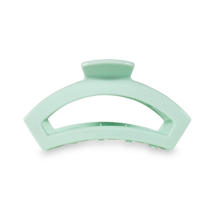Medium open-style hair clip in mint green with bendable teeth