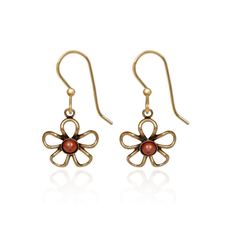 Open wirey flower earrings with cabochon stones in raw brass featuring natural textures and glass beads.