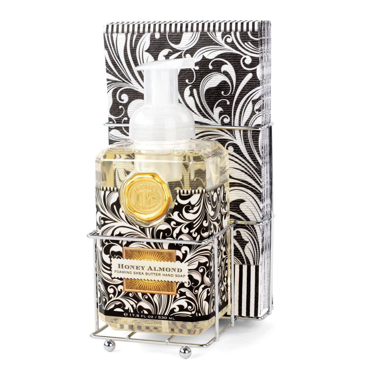 Foaming soap dispenser with matching napkins in a compact countertop set.