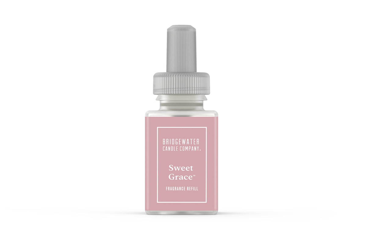 Sweet Grace Pura+Bridgewater fragrance refill bottle with clear glass body showing amber liquid and minimalist white label.