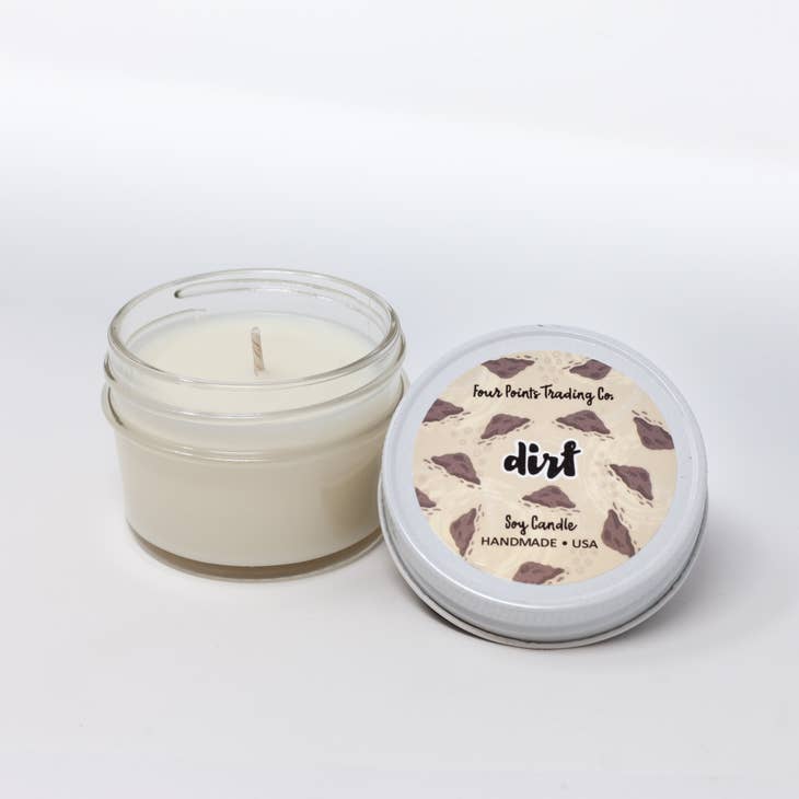 Pop Scents soy candle in a clear glass jar with white wax.