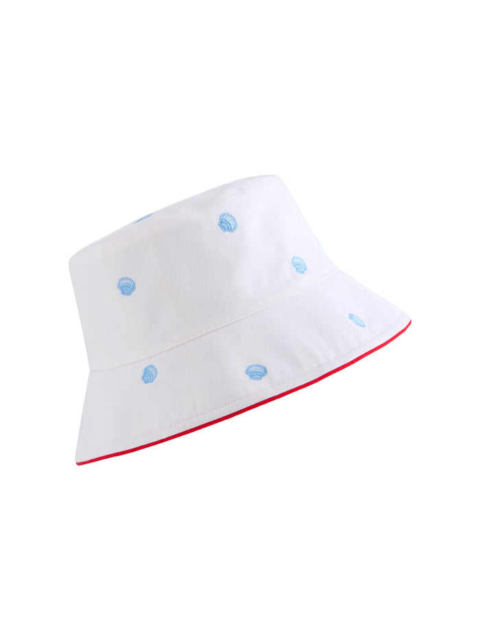White canvas bucket hat with light blue embroidered seashells and a red trim on the brim.