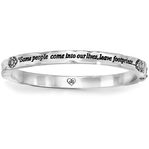 Silver plated magnetic hinged bangle featuring Swarovski crystals with a footprint message pattern.