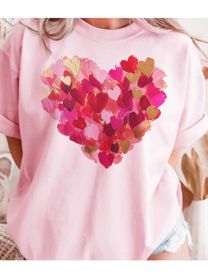 Unisex poly cotton blend graphic tee featuring a watercolor heart with brushstroke patterns in red and white.