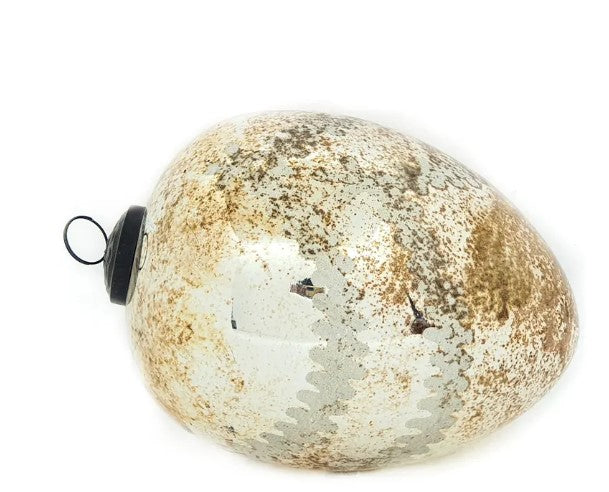 Notre Dame glass egg ornament in gold with cathedral window patterns
