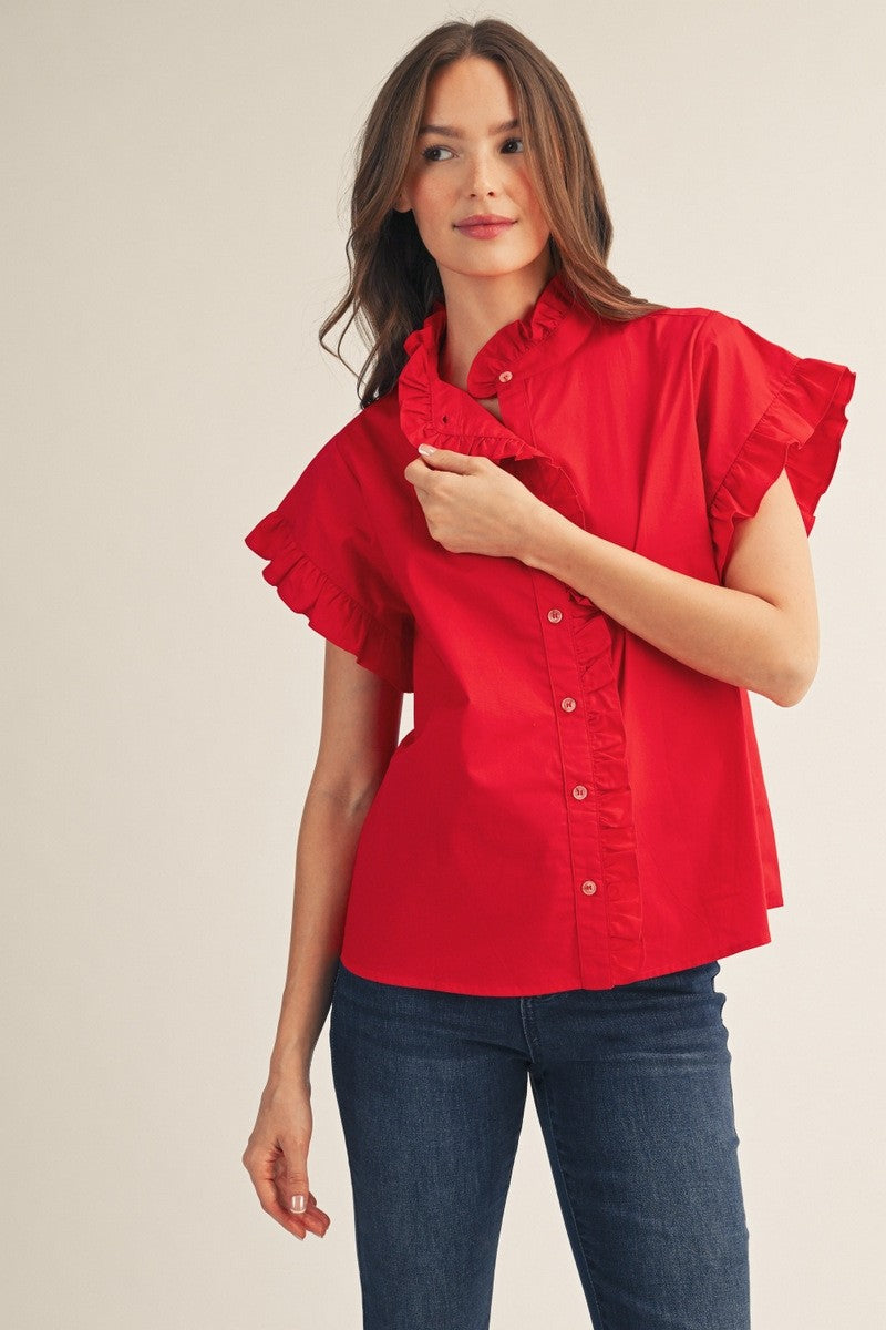 Woman wearing a red Elise Ruffled Detail Woven Top with short ruffle sleeves and a button-up front.