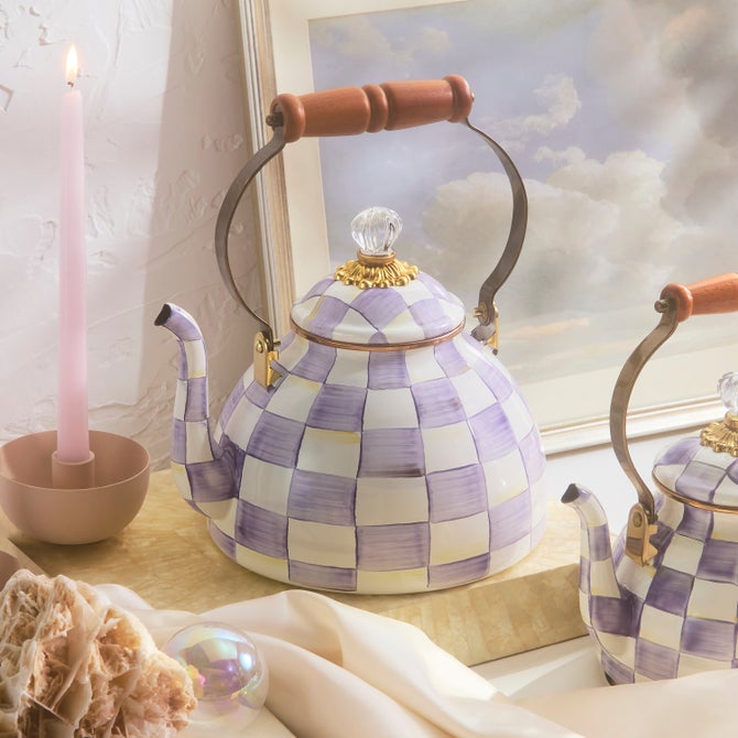 Violet checkered enamel tea kettle with a curved handle and knob