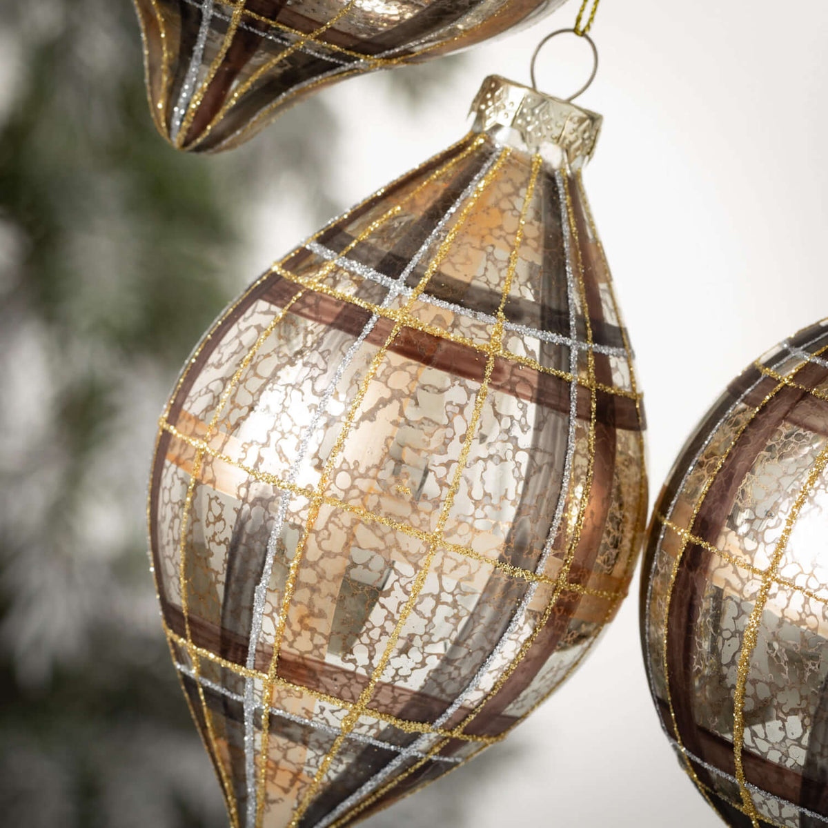 Brown gold glass plaid ornament with a luster finish