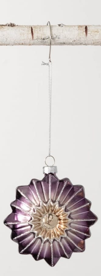 Purple and gold star-shaped glass witch eye ornament with silver glitter accents.