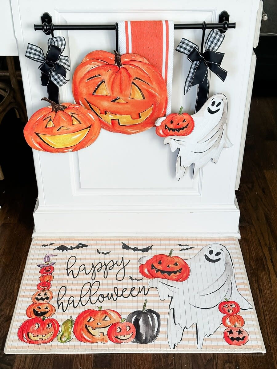 Orange Jack-O-Lantern stake decoration with carved pumpkin face silhouette.