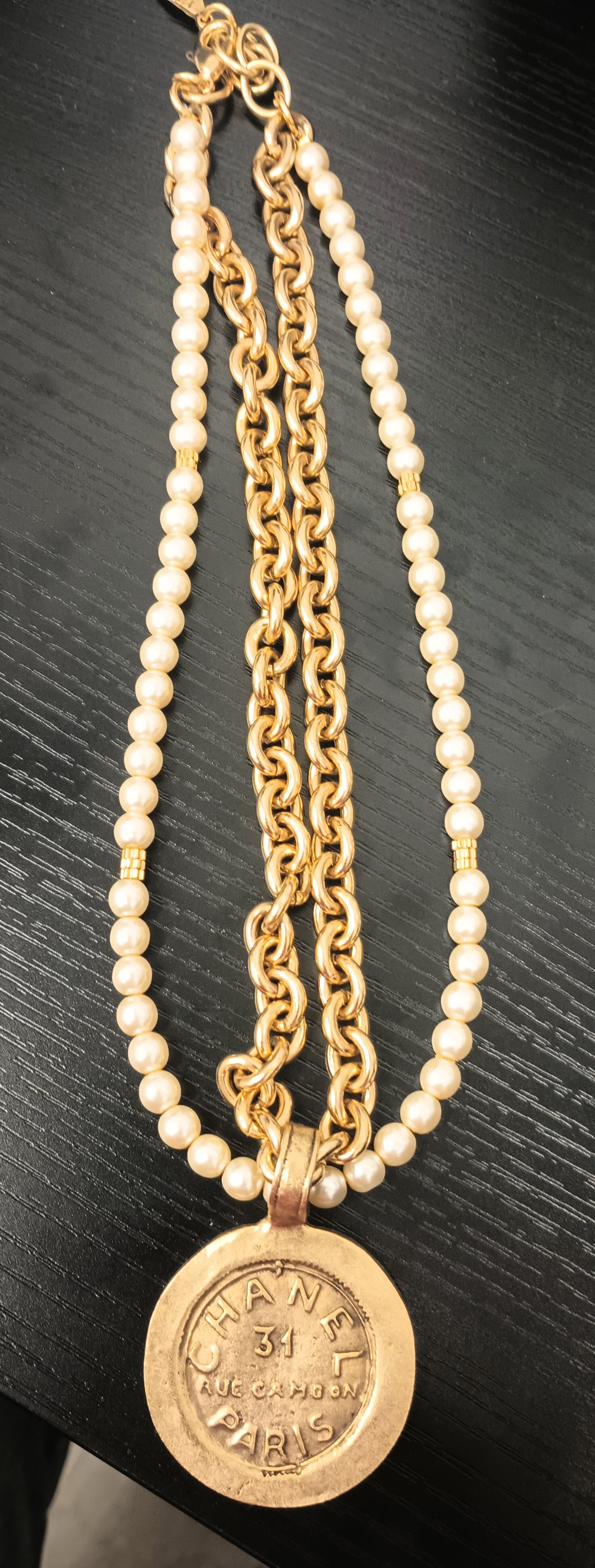 8-inch gold link necklace with pearl strands and a Chanel-style coin pendant