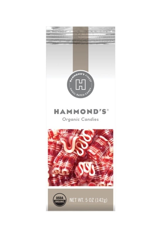 Bag of organic mint mini ribbon candy with red and white striped wrappers.