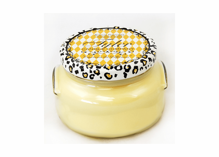 A white ceramic jar containing a Tyler Candle with visible wicks.