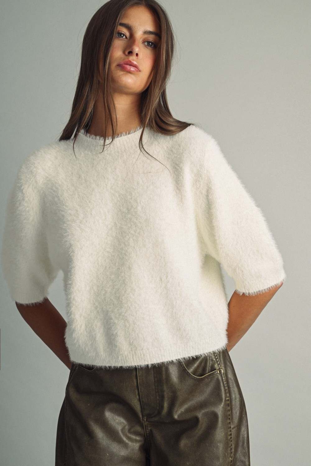 White Alexa fluffy cropped faux-fur sweater with round neck and elbow-length sleeves.