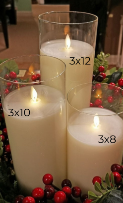 Three moving flame LED glass pillar candles in 3x8, 3x10, and 3x12 sizes with holiday greenery.