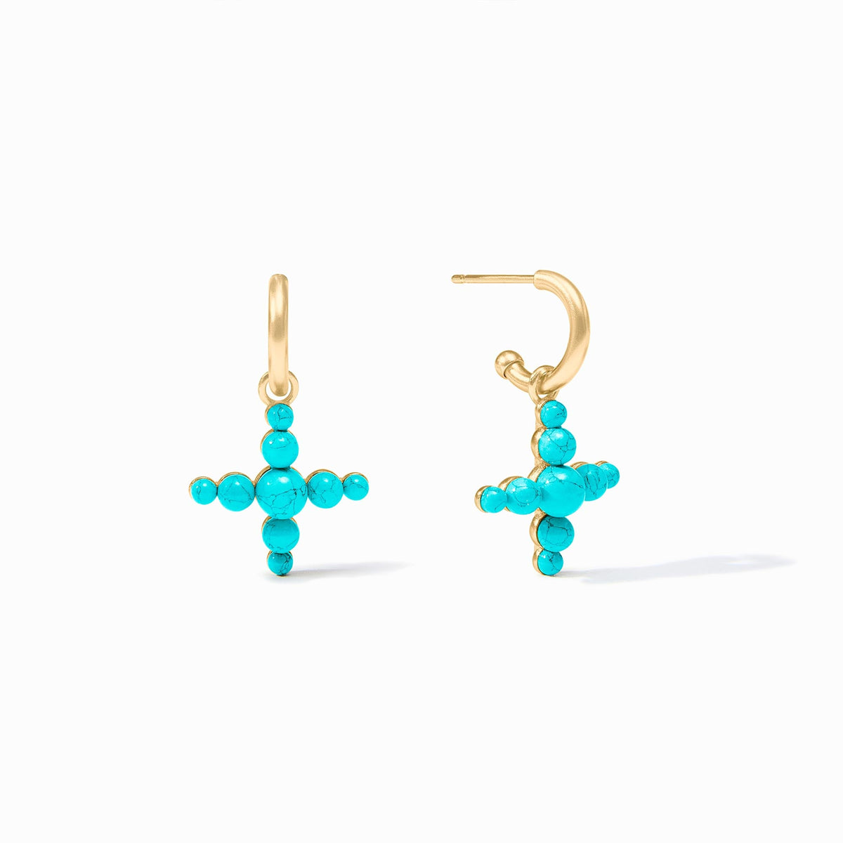 Dangling cross-shaped earring with golden huggie hoops and reconstituted gemstone beads.