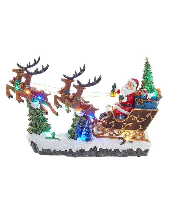 Battery-operated LED musical Santa in sleigh with reindeer, Christmas tree, toys, and multi-color lights.