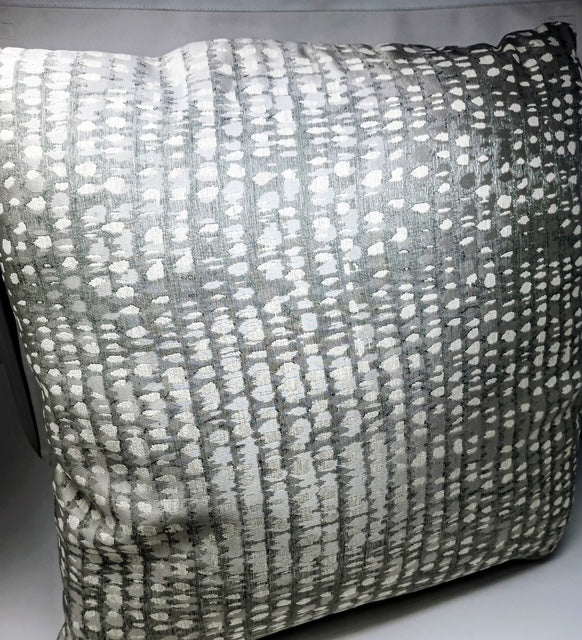 A 24x24 hand-crafted pillow with a textured gray and white abstract dot pattern.