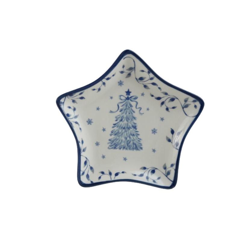 Star-shaped white ceramic dish with blue holiday tree, snowflakes, and vine patterns.