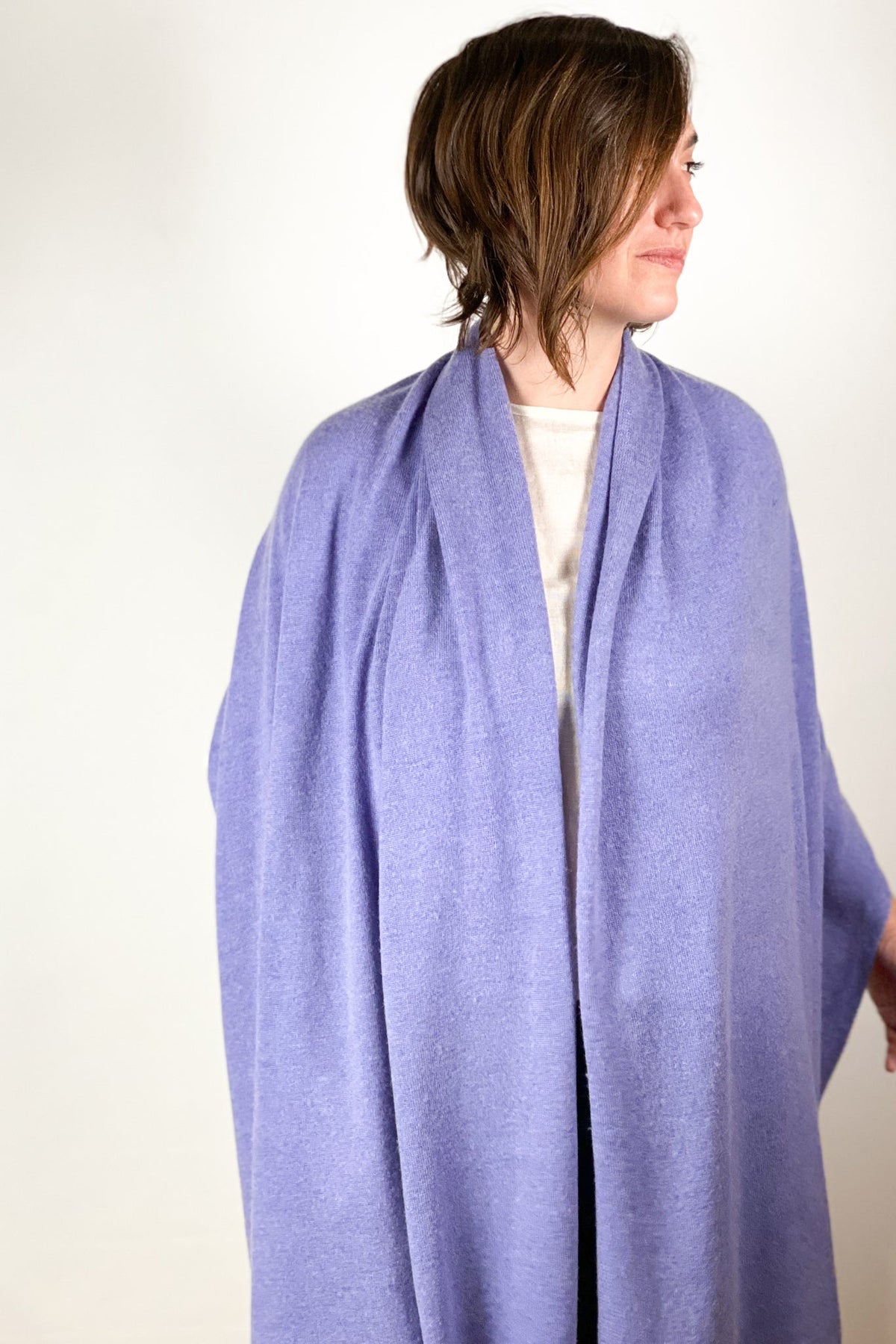 Solid cashmere scarf in a neutral tone with soft drape.