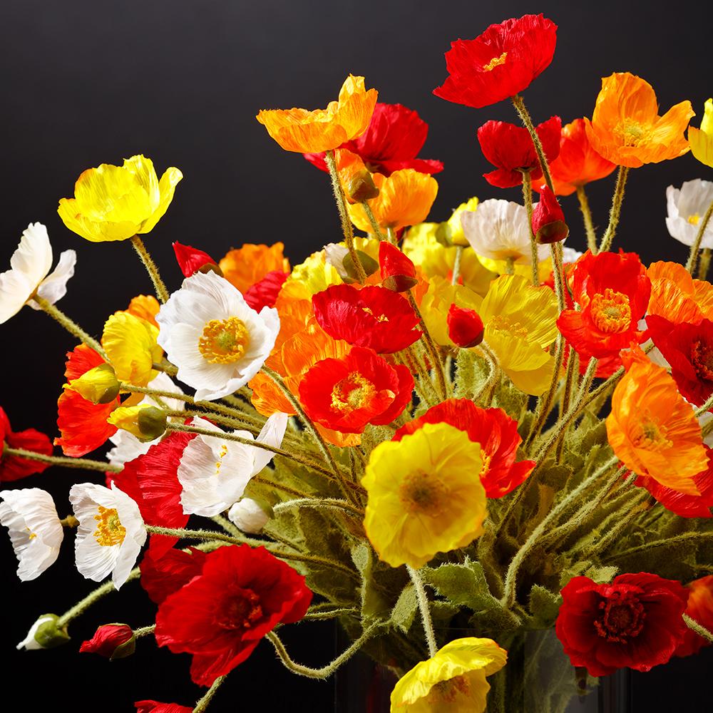 Poppy spray floral arrangement with red fabric petals on wire stems.