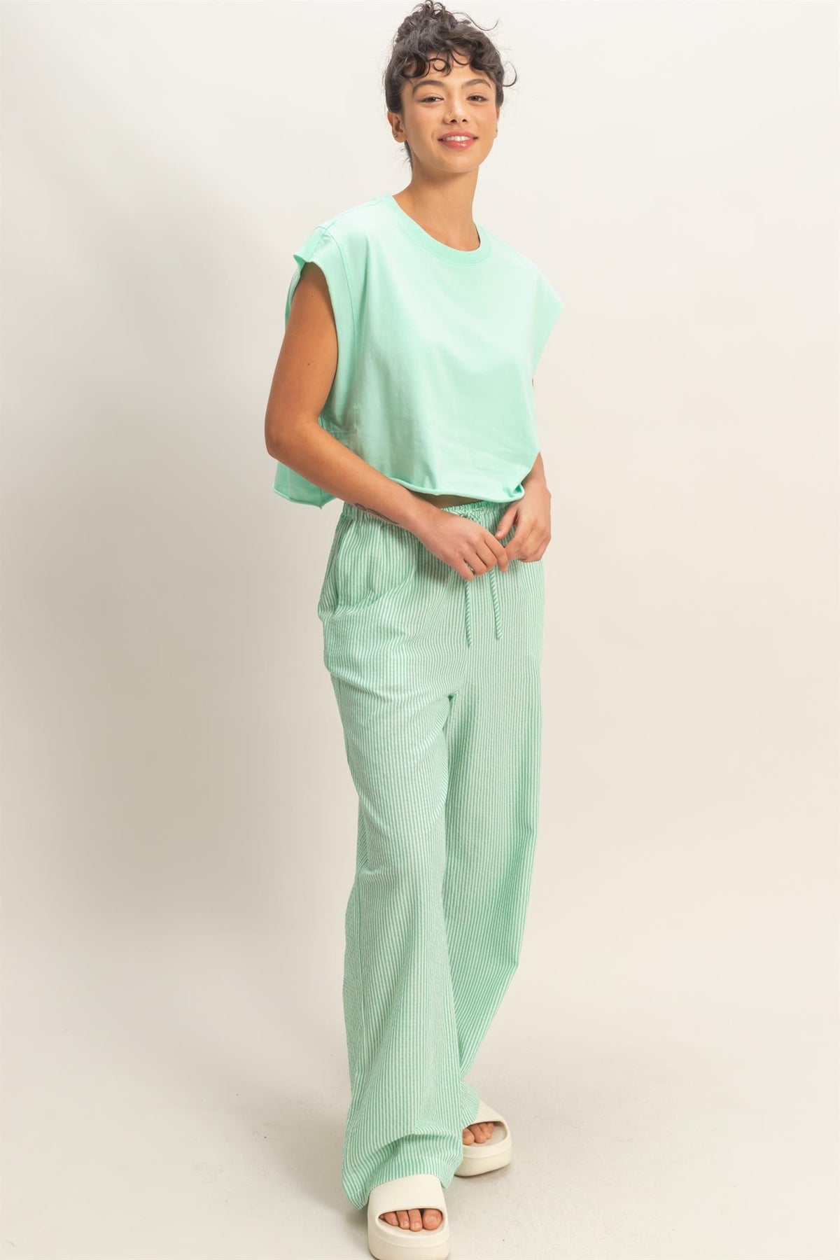 Arianne striped wide leg pants in polyester rayon blend with a relaxed silhouette.