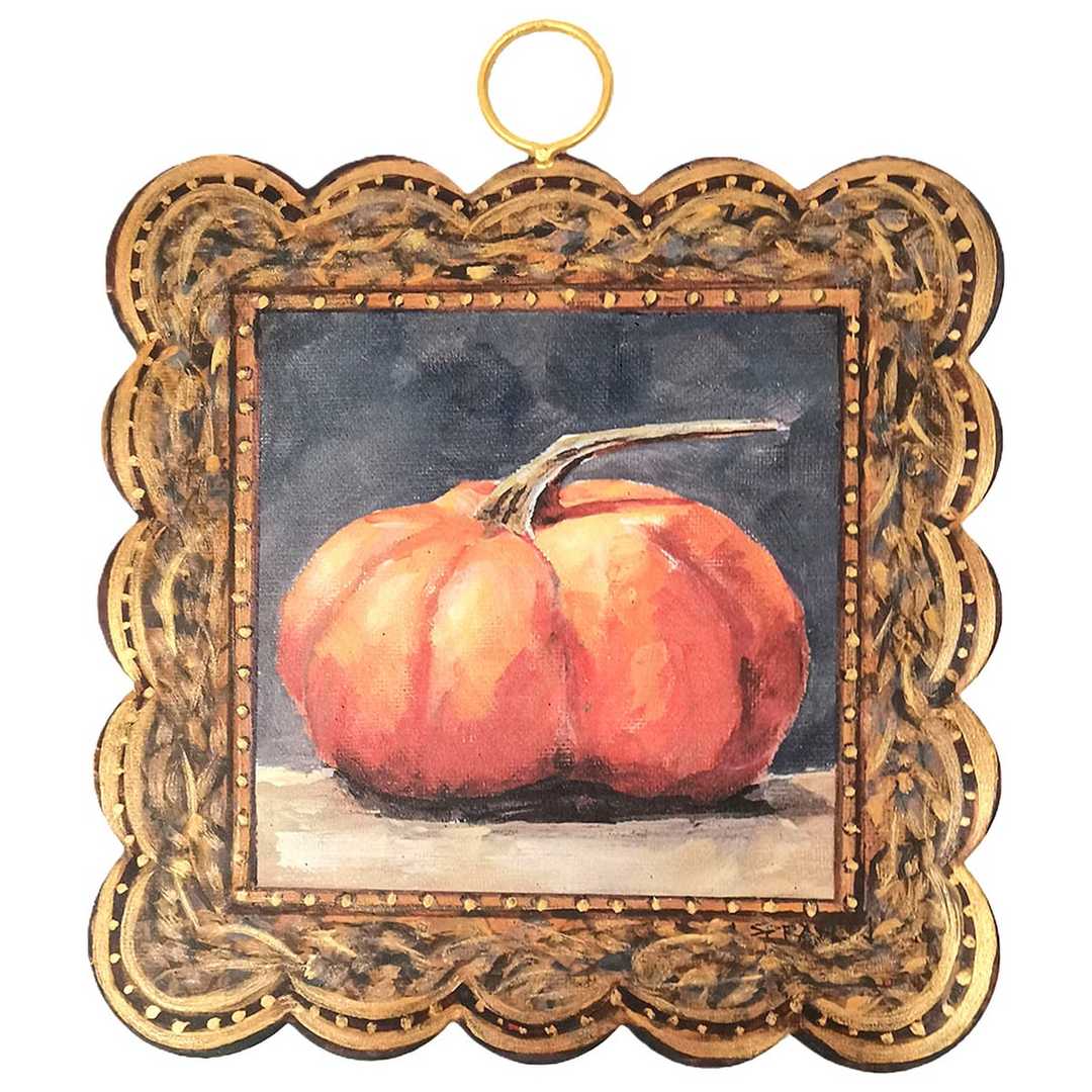Mini scalloped art piece with a gilded frame featuring a painted orange pumpkin on a dark background
