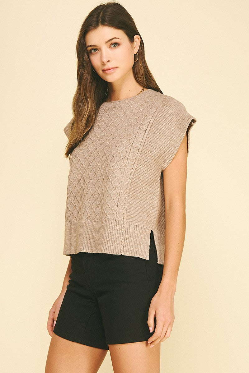 Lyndsey diamond cable knit sweater in soft gray with a relaxed fit silhouette.