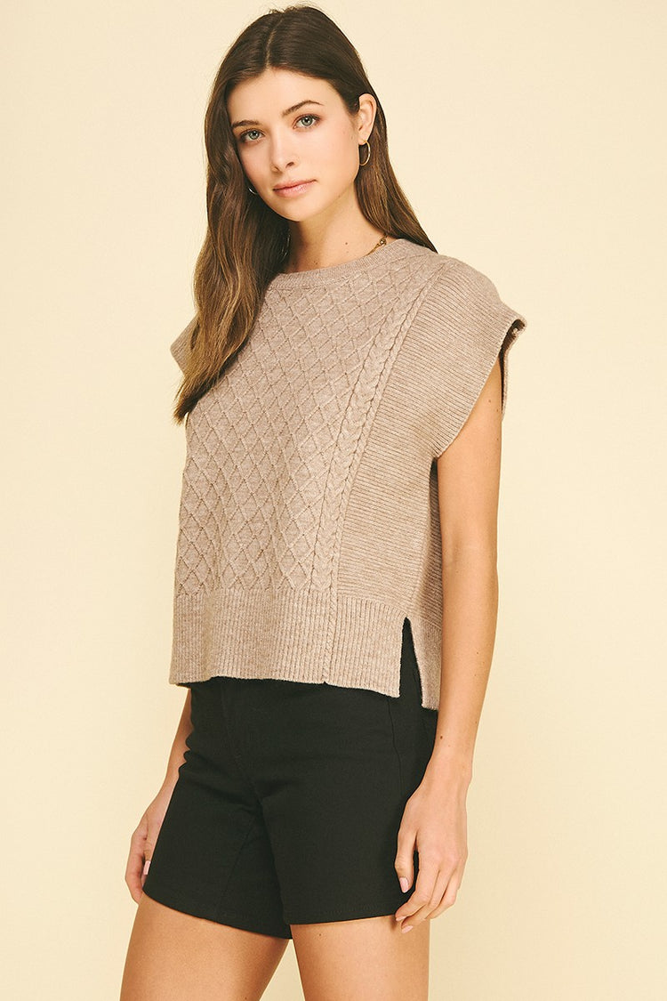 Lyndsey diamond cable knit sweater in soft gray with a relaxed fit silhouette.