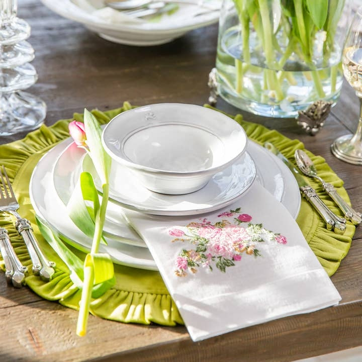 Round ruffle velvet placemat in a soft neutral tone with an 18-inch diameter.