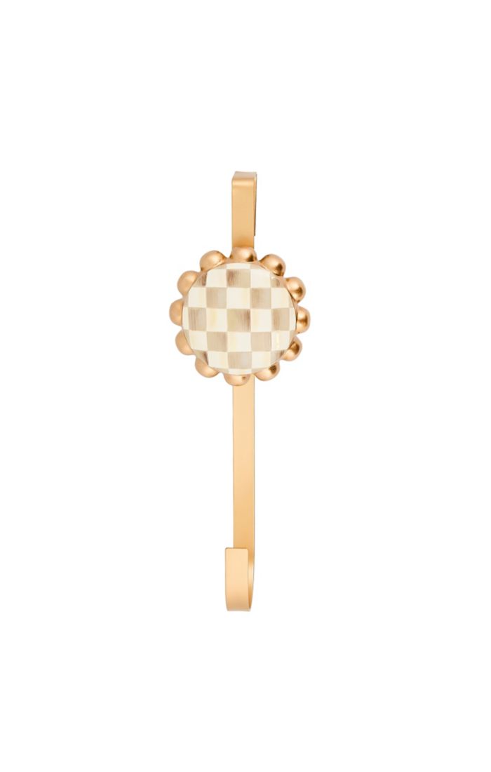 Mocha Check Wreath Hanger with a gold-tone metal frame and a checkered resin center.