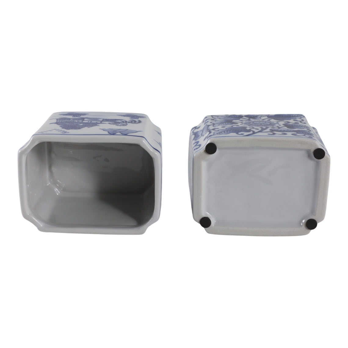 Top and bottom view of a blue and white ceramic rectangle pencil cup with floral and landscape art.