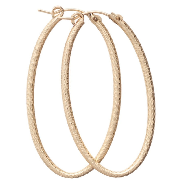 Textured gold oval hoop earring with a polished finish