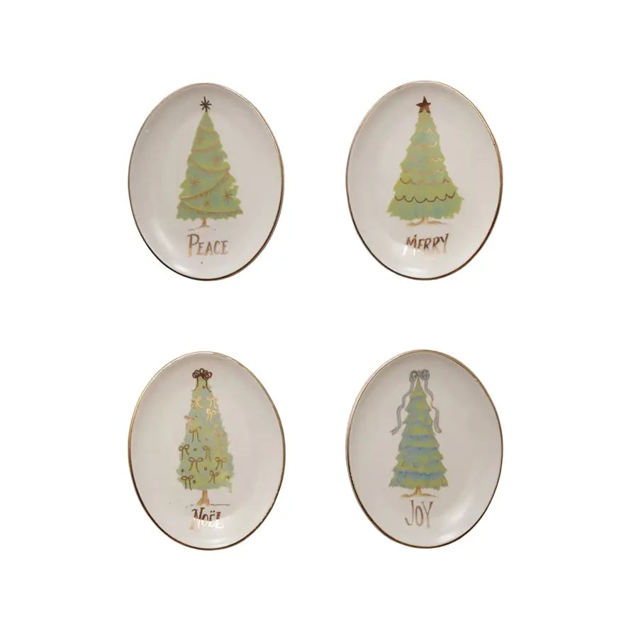 Oval stoneware dish with festive holiday word text in white on a neutral background.